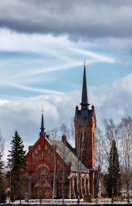 Church of Eura in front of a partly cloudy sky