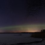 Northern Lights over a frozen lake